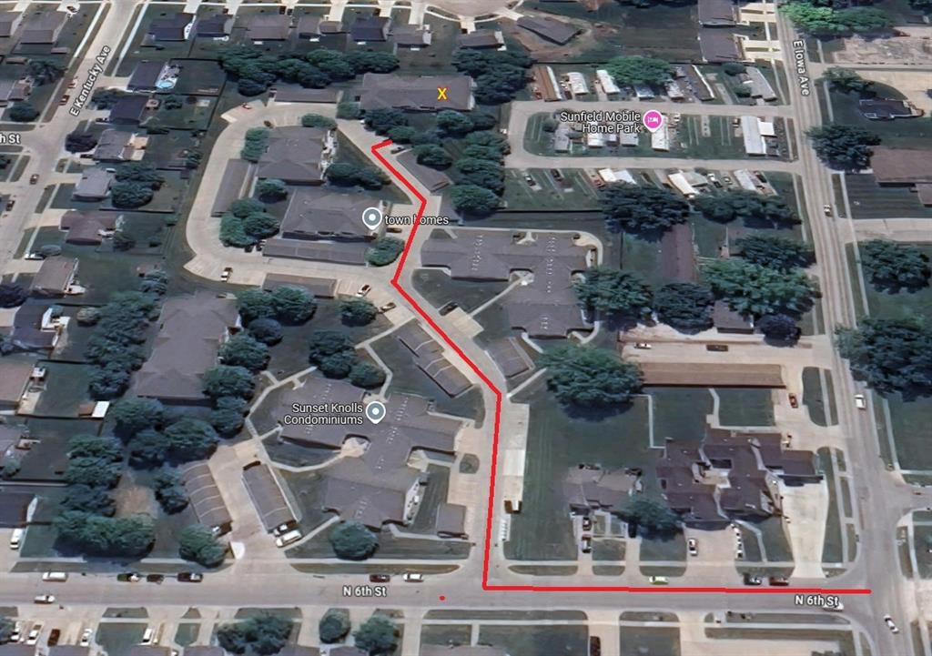 Aerial view of a residential area showing a red line path starting at one street, winding through a complex with multiple buildings, and ending at a location marked with an "X." Nearby streets and a wildlife park are visible.