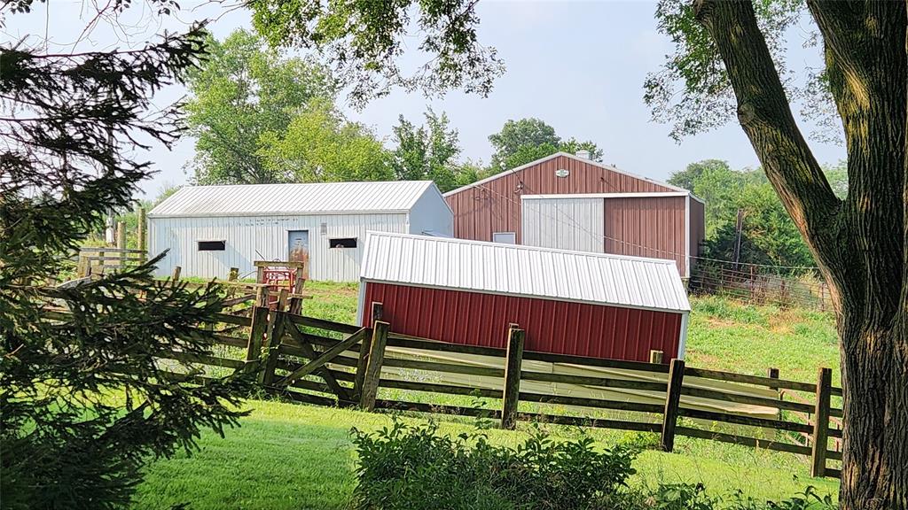 14434 US-65 Acreage 28 A group of buildings in a field.